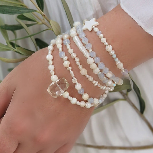 Detail of Sivona’s white gemstone wrap bracelet on wrist showcasing sterling silver clasp and 3–4 mm beads