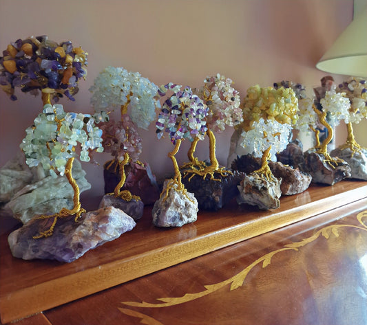 Hands selecting spiritual gift with crystals and meaningful energy decor