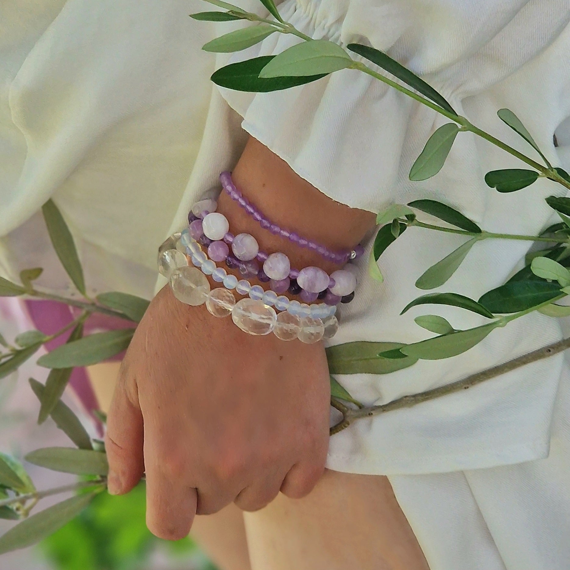 Anremo Azar five‑bracelet set featuring Himalayan quartz, pale lavender jadeite, jadeite & aquamarine mix, moonstone‑topaz‑tanzanite blend, and amethyst harmony bracelets