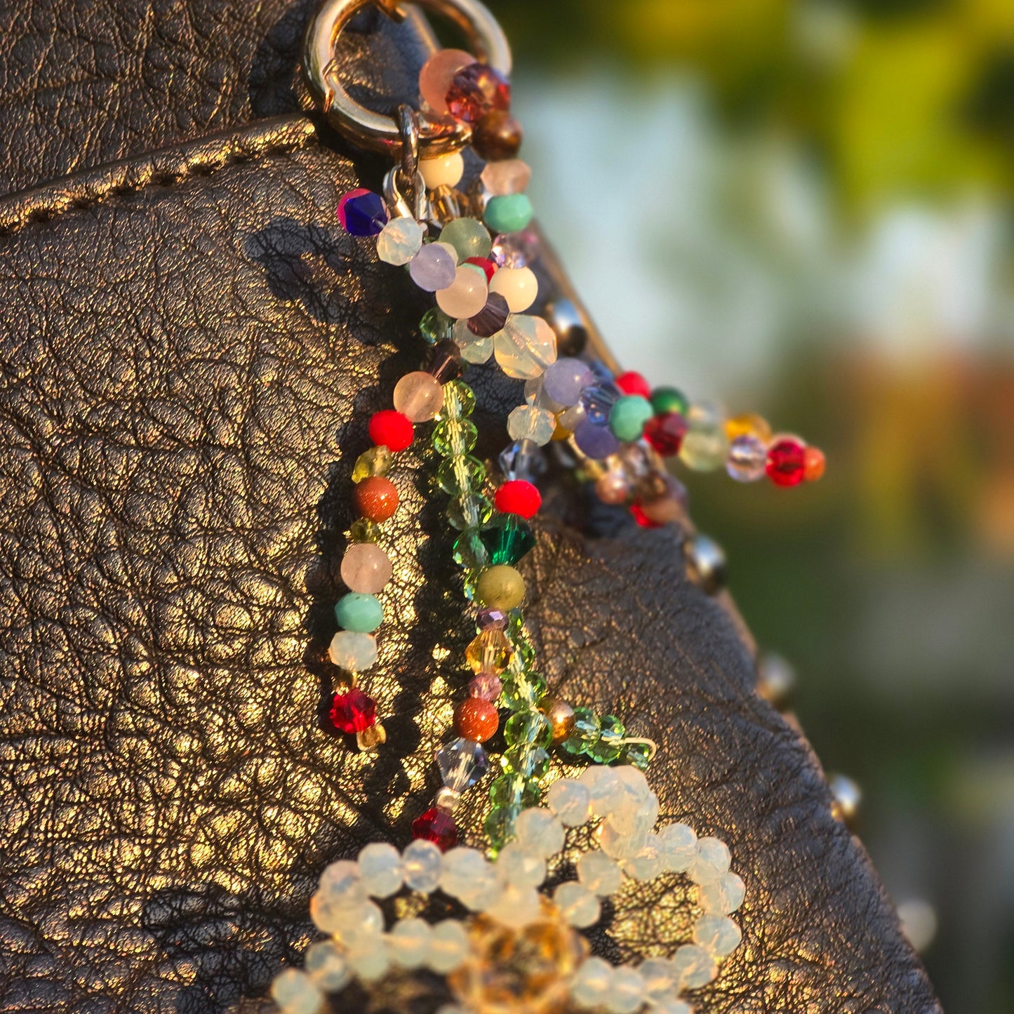 Elegant purse charm with Austrian crystal flower, moonstone, tourmaline, rose quartz, jade and amethyst gemstones.