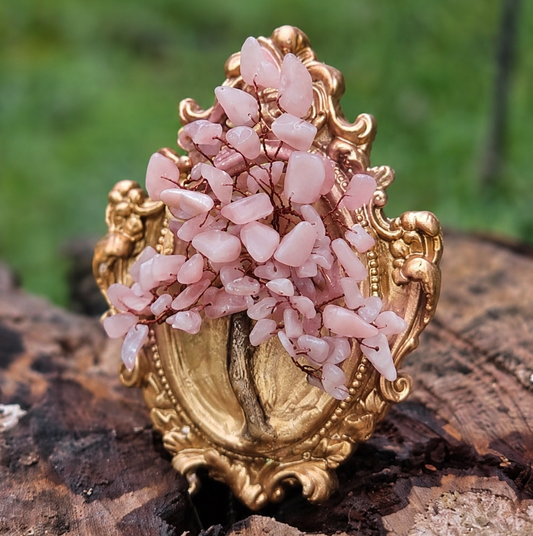 Handcrafted rose quartz crystal tree making process with ceramic frame and natural gemstones