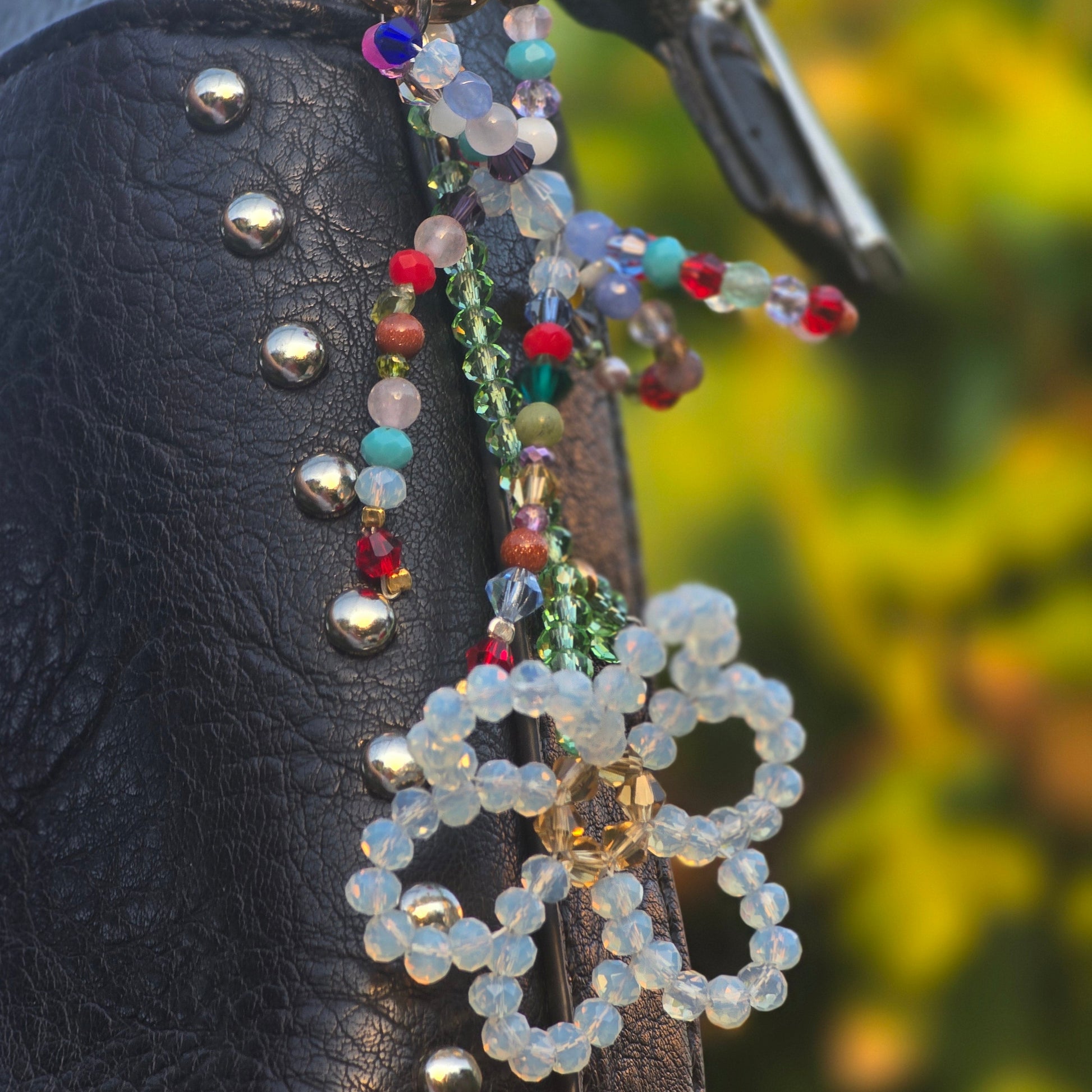 Luxury flower bag charm handcrafted with Austrian crystals and genuine gemstones including moonstone, tourmaline, agate, jade, amethyst, rose quartz and carnelian.