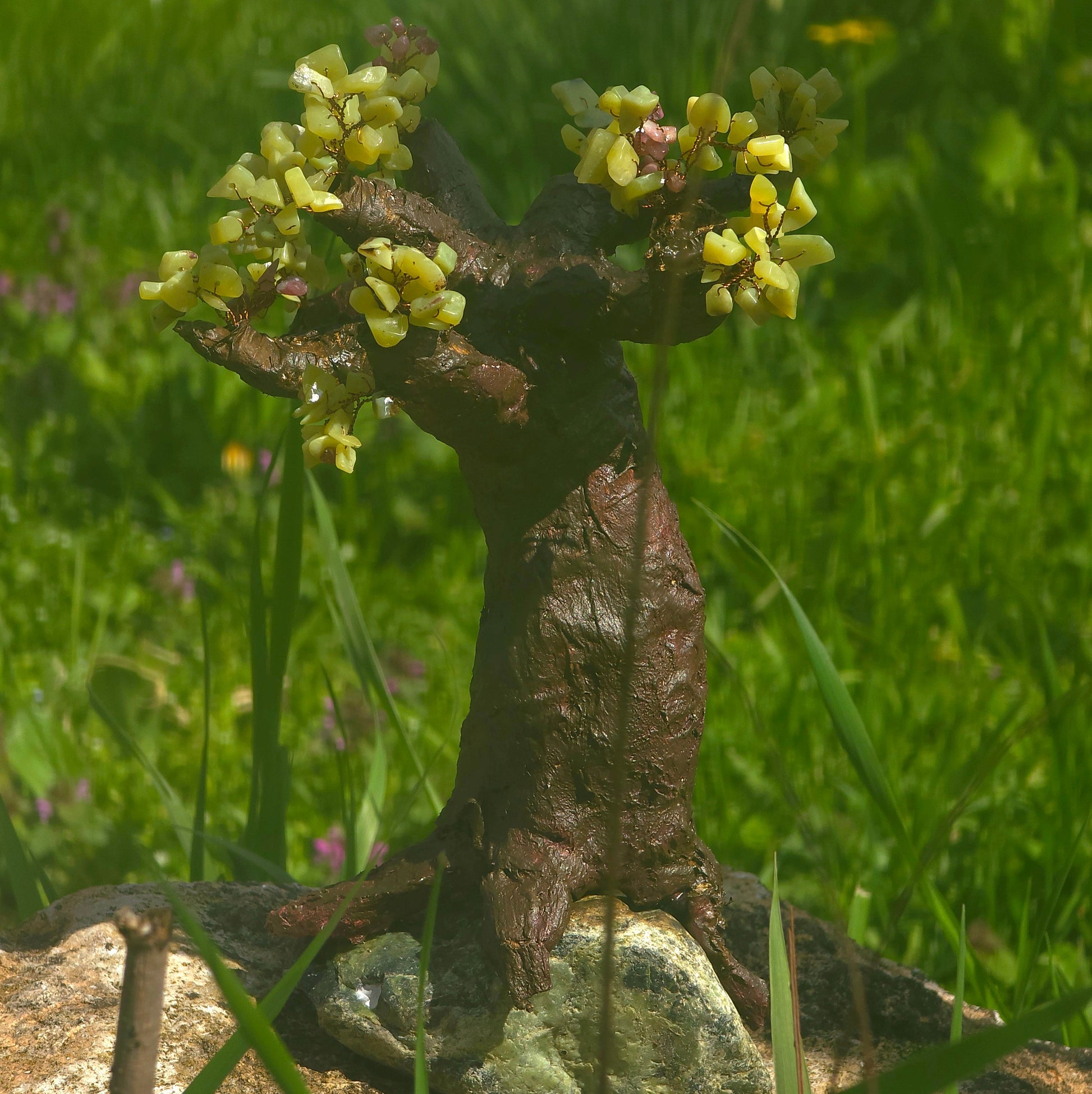 Luxury handmade Peridot Tree of Life sculpture crafted with natural Peridot gemstones on a natural stone base – one of a kind crystal artwork