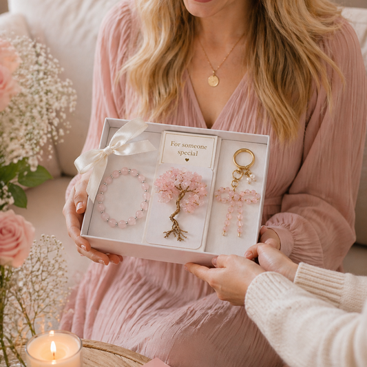 woman receiving rose quartz crystal gift set in open box, handmade gemstone jewelry gift for her, luxury meaningful present