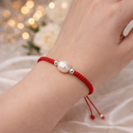 Red string bracelet with natural pearl worn on wrist, spiritual protection jewelry