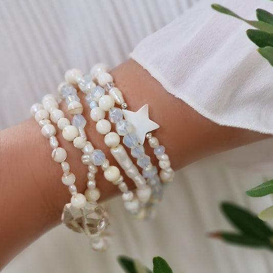 White gemstone wrap bracelet by Sivona styled on wrist with 6 elegant loops for energy healing